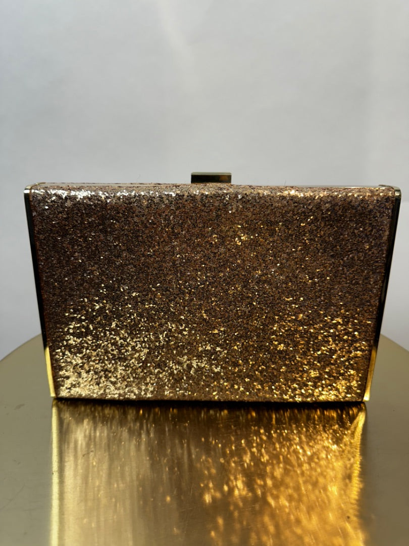 Accessorize gold glitter clutch, Size 9” x 6”